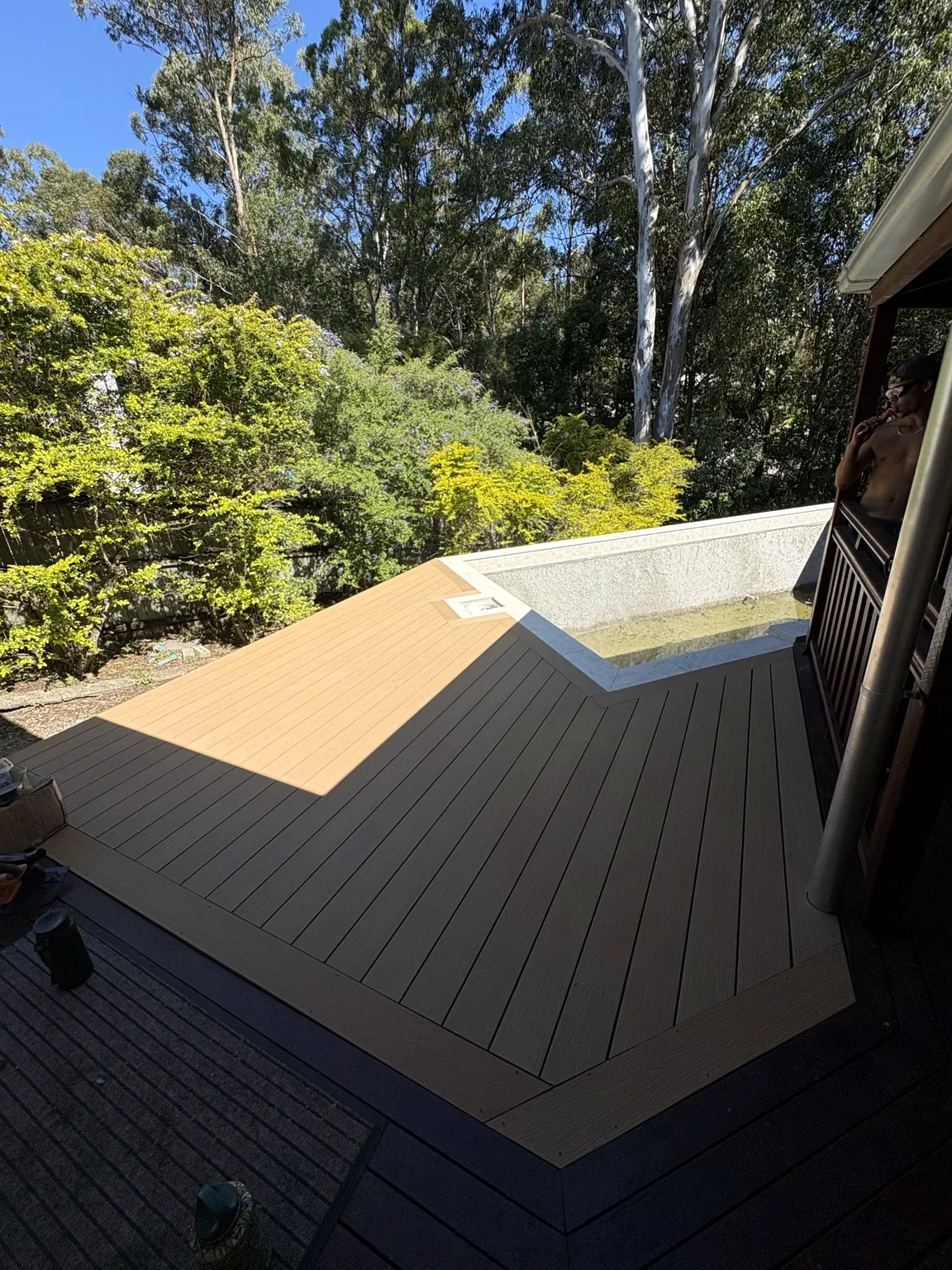 Modern poolside deck with clean geometric board layout